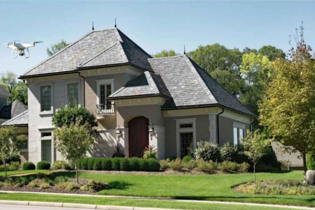 Roof survey Worcester showing a detailed inspection of pitched slate roofing and flashing