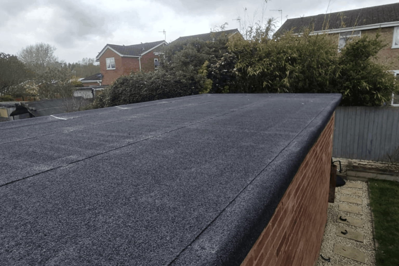 Flat roof vs pitched roof on a UK home.