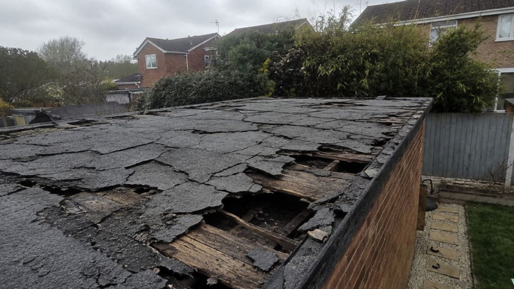 Water damage on a flat roof requiring repair.