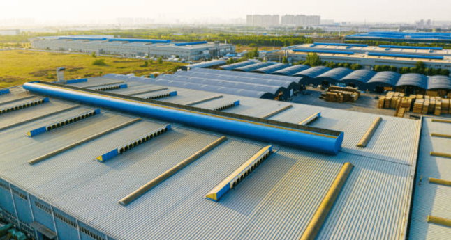 Warehouse roofing Worcester commercial roofing installation on large building.